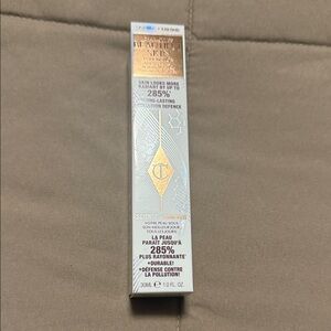 Charlotte Tilbury Radiant Skin Foundation in Silver and Gold